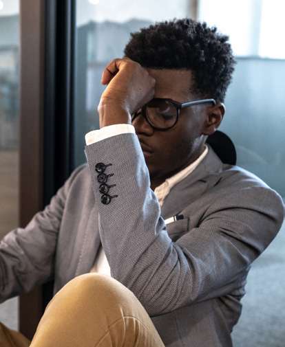 Man experiencing a migraine.