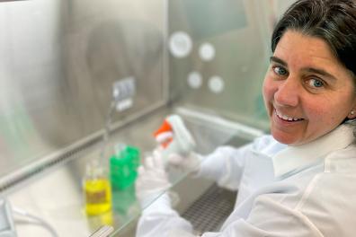 Woman working in biosafety cabinet